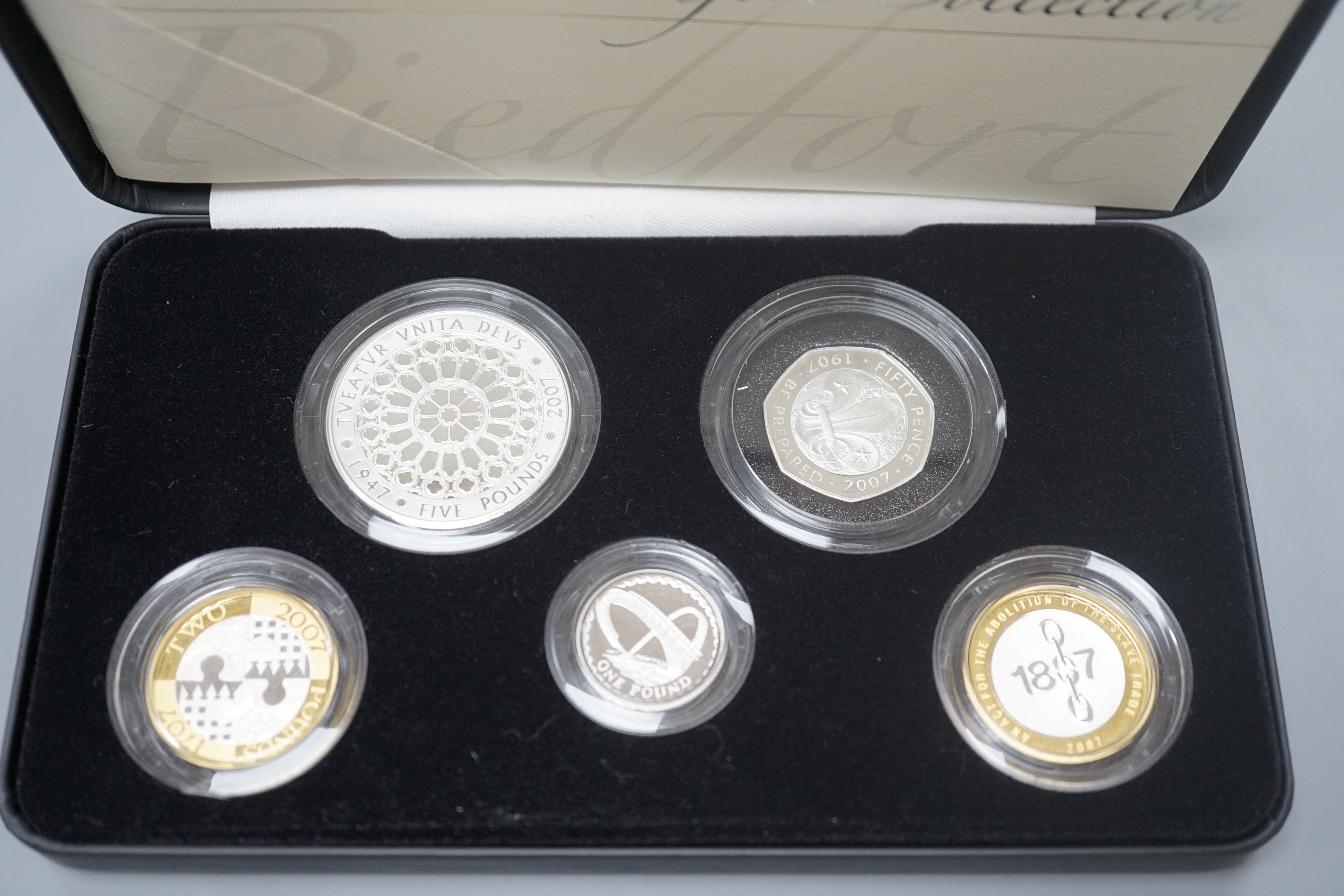 A cased Royal Mint UK Piedfort collection of silver proof coins 2007 and a cased set of four silver proof £1 coins, 2010/11